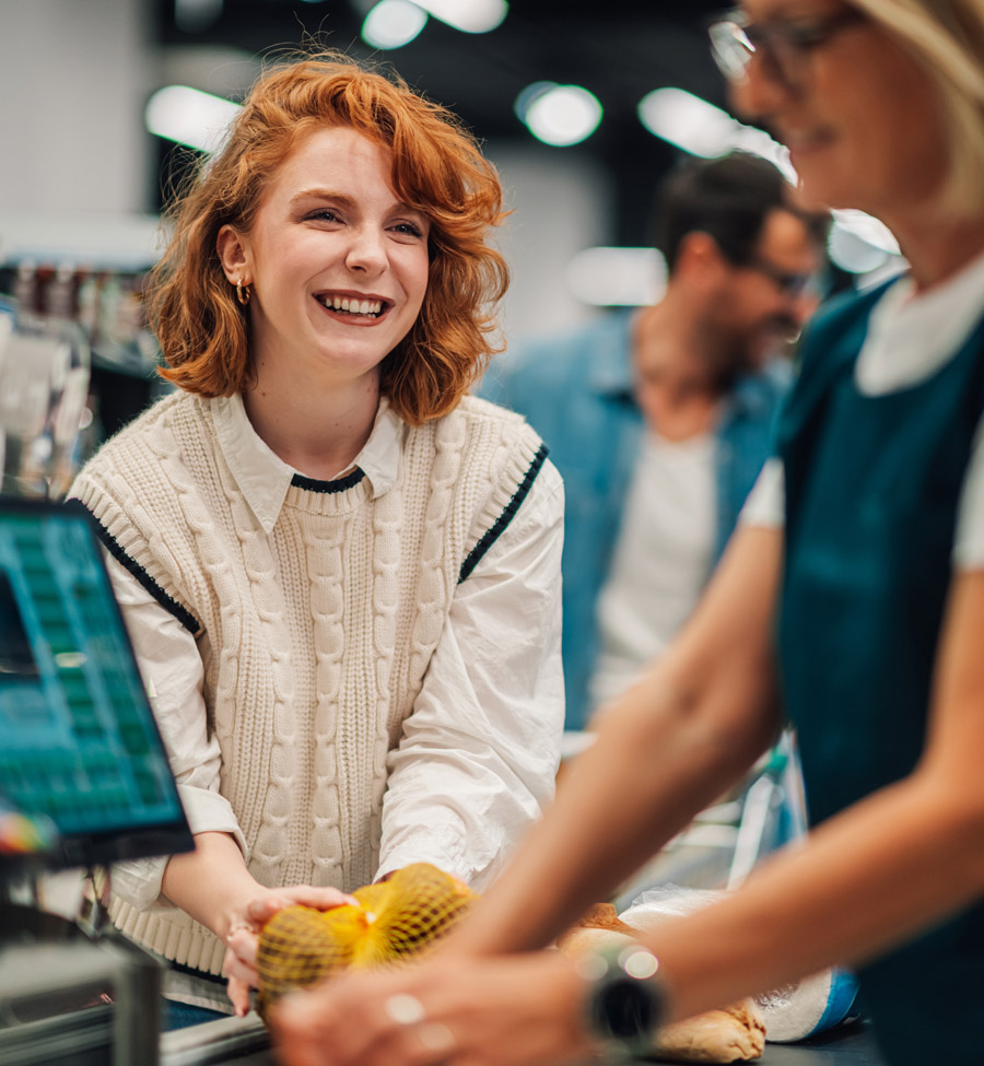 Woman checking out at grocery store