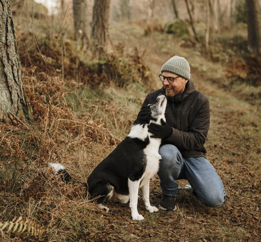 Active man outdoors with pet dog
