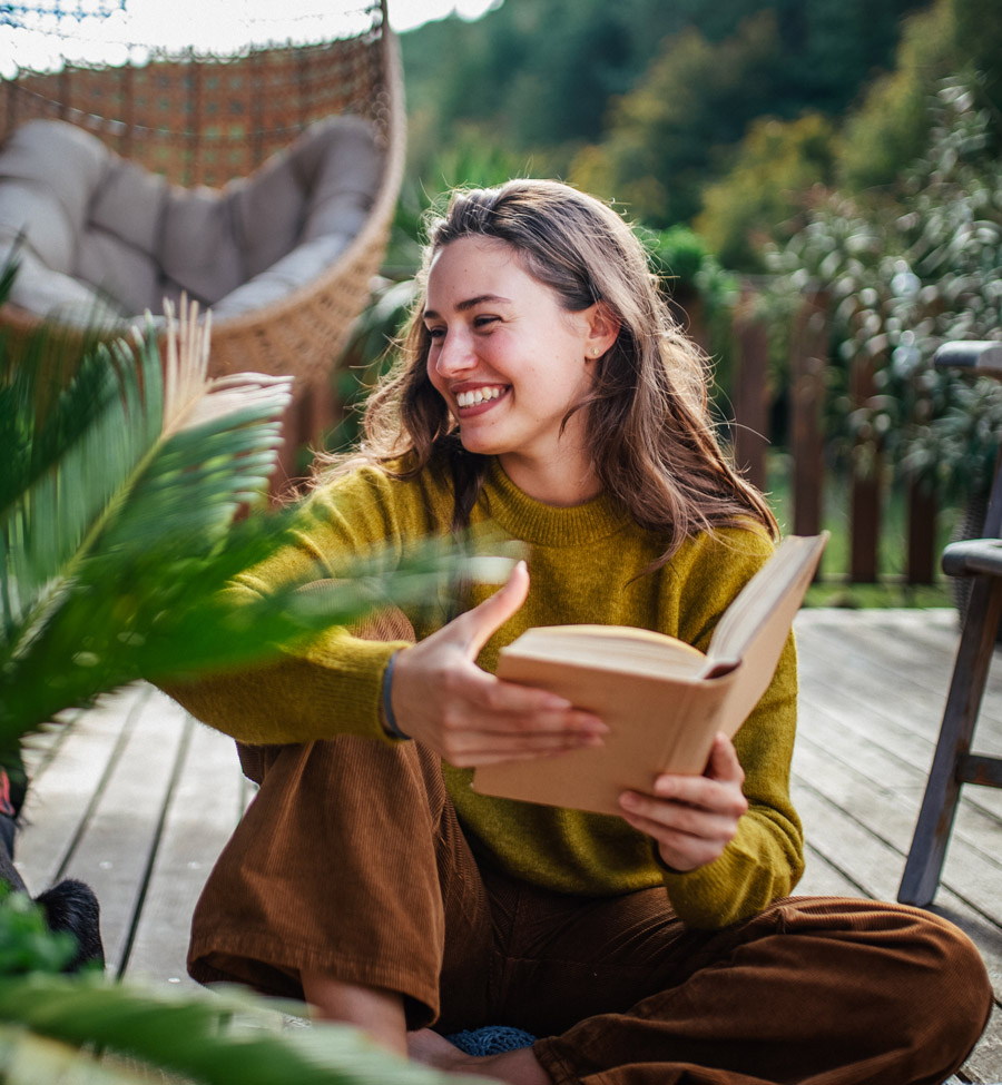 Woman reading a book outdoors