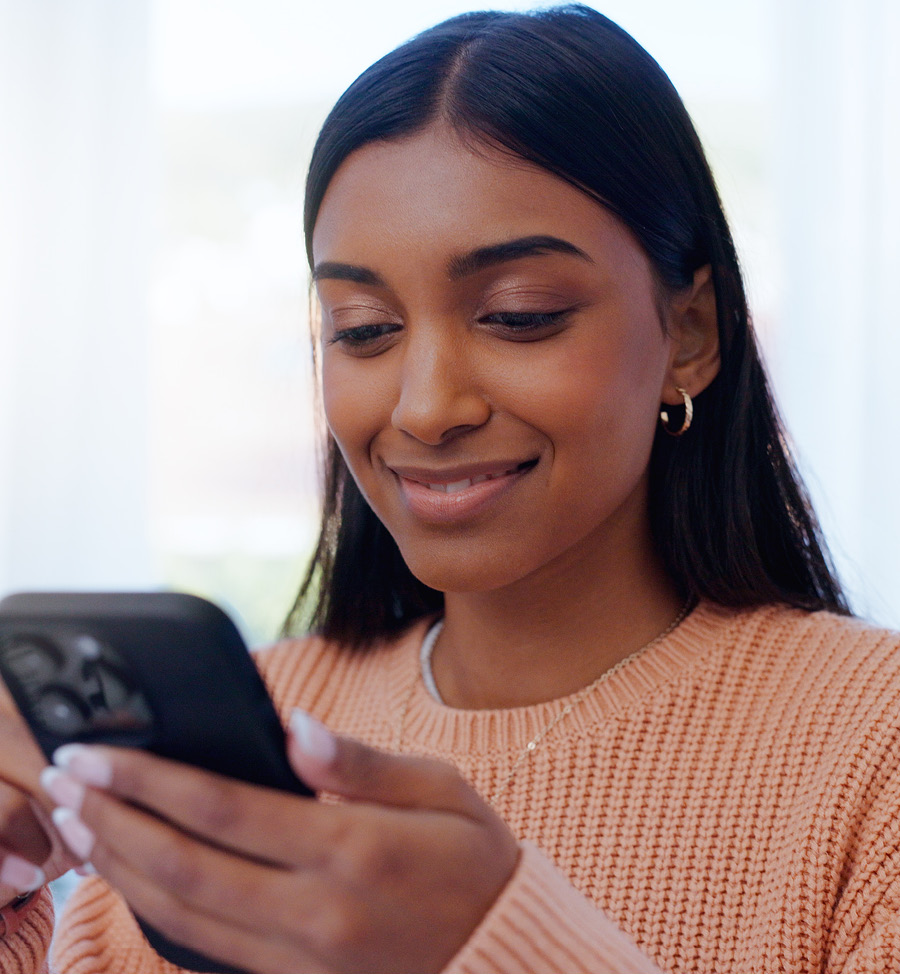 Young female with mobile phone in hand