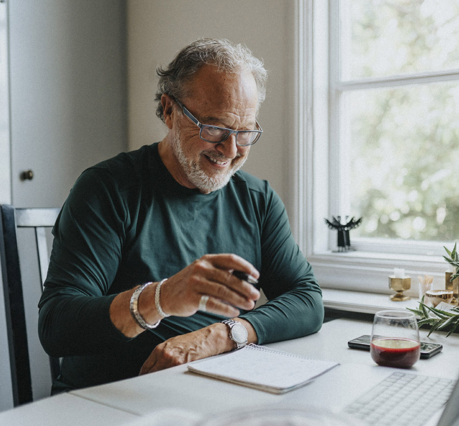 Mature man taking notes