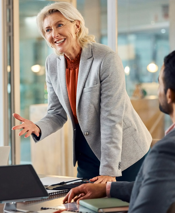 Business woman speaking to coworkers