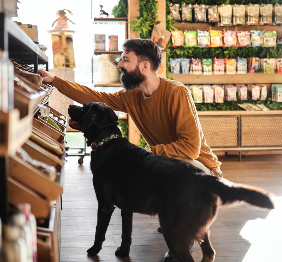 Young adult shopping with dog